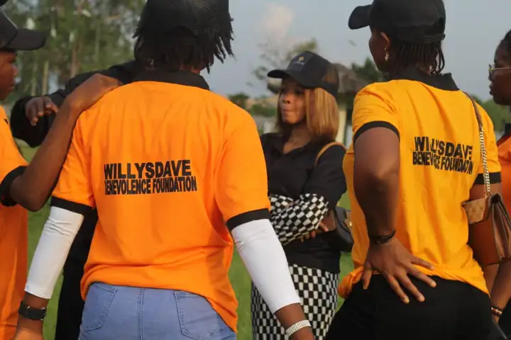 WillysDave volunteers in orange tees at the outreach ground