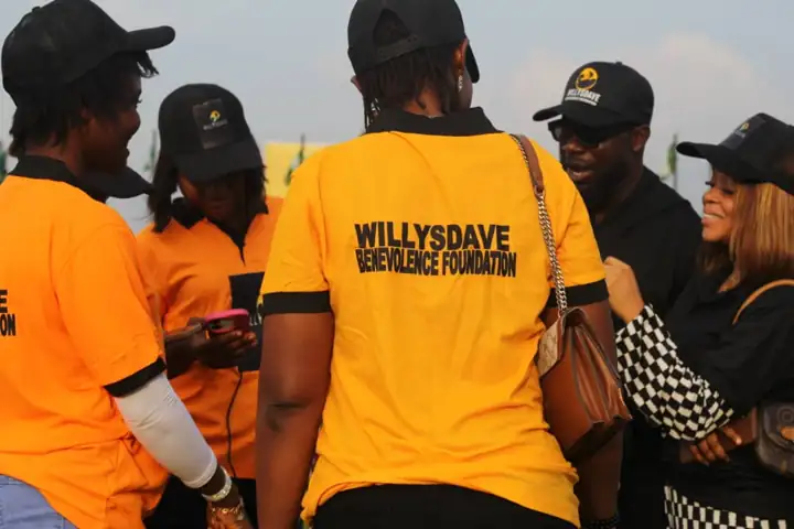 WillysDave volunteers in orange tees at the outreach ground