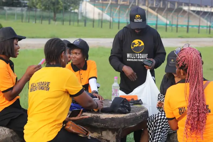 WillysDave volunteers in orange tees at the outreach ground