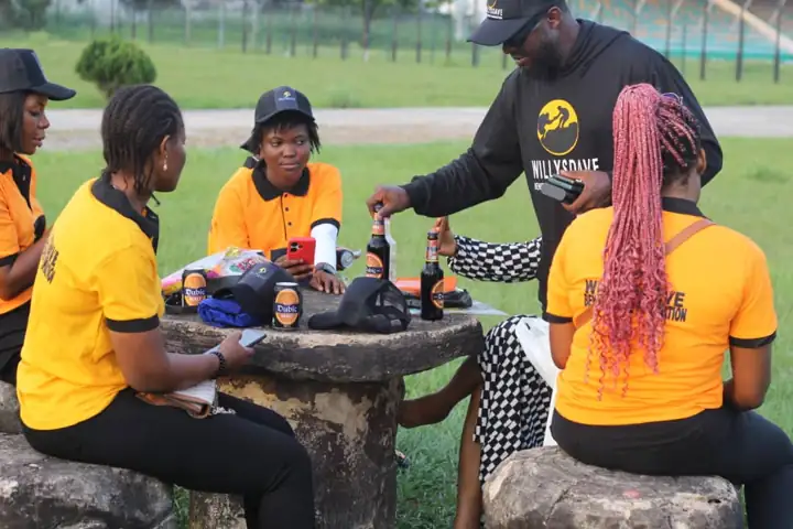 WillysDave volunteers in orange tees at the outreach ground